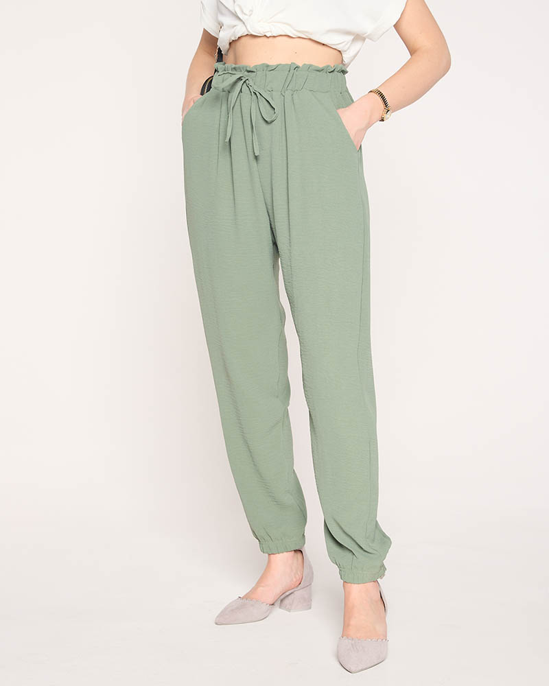 Materiałowe damskie spodnie w kolorze zielonym PLUS SIZE- Odzież