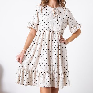 Beżowa damska sukienka mini w groszki - Odzież