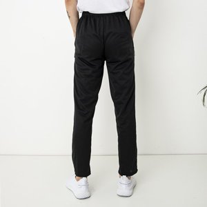 Czarne męskie spodnie dresowe z kieszeniami i napisem - Odzież