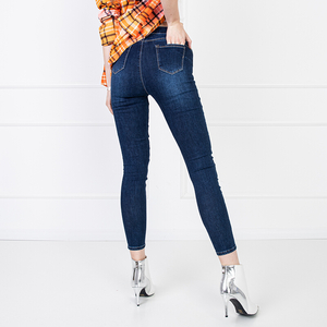Granatowe jeansy damskie ze średnim stanem - Odzież