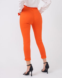 Materiałowe spodnie damskie z wysokim stanem w kolorze pomarańczowym - Odzież