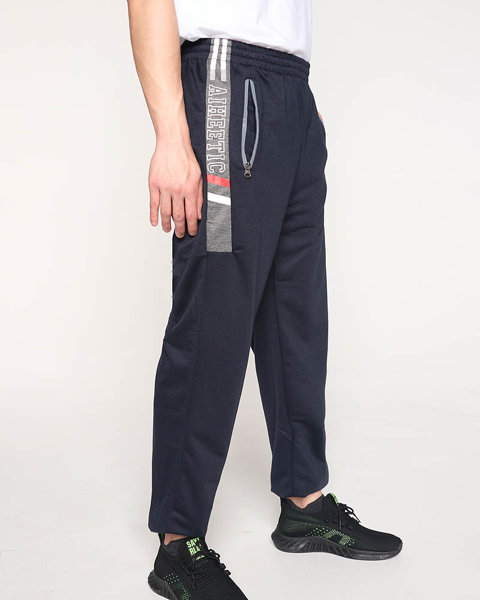 Męskie granatowe spodnie dresowe z napisami - Odzież