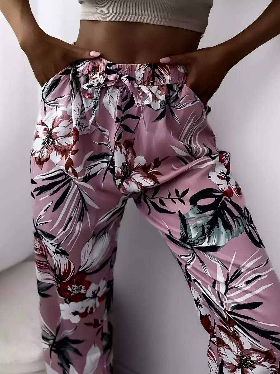 Royalfashion Jasnoróżowe damskie spodnie materiałowe z roślinnym wzorem