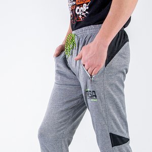 Szare męskie spodnie dresowe z printem  - Odzież