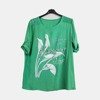 Zielona tunika damska z printem i napisami - Odzież