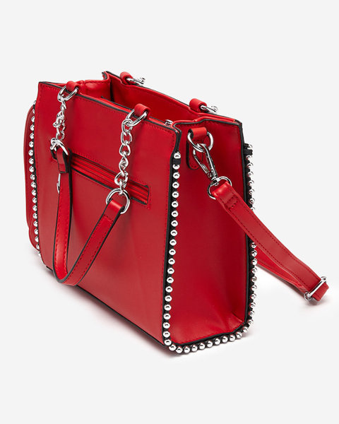 Червона жіноча сумочка з плетеною вставкою